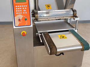 Mimac cookie extruder complete with wire cutter and several molds; the 60-cm side of the baking sheet is loaded.